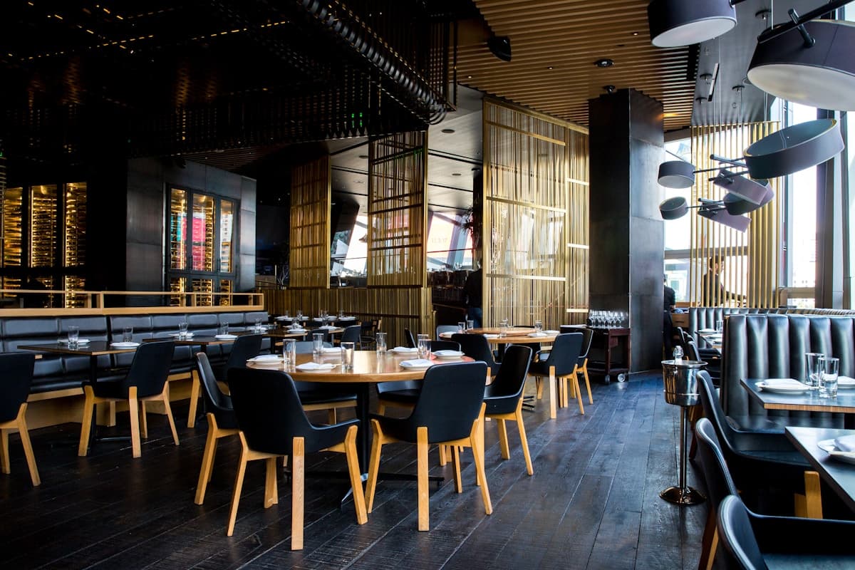 Detroit restaurant dining room with warm lighting and guests at tables