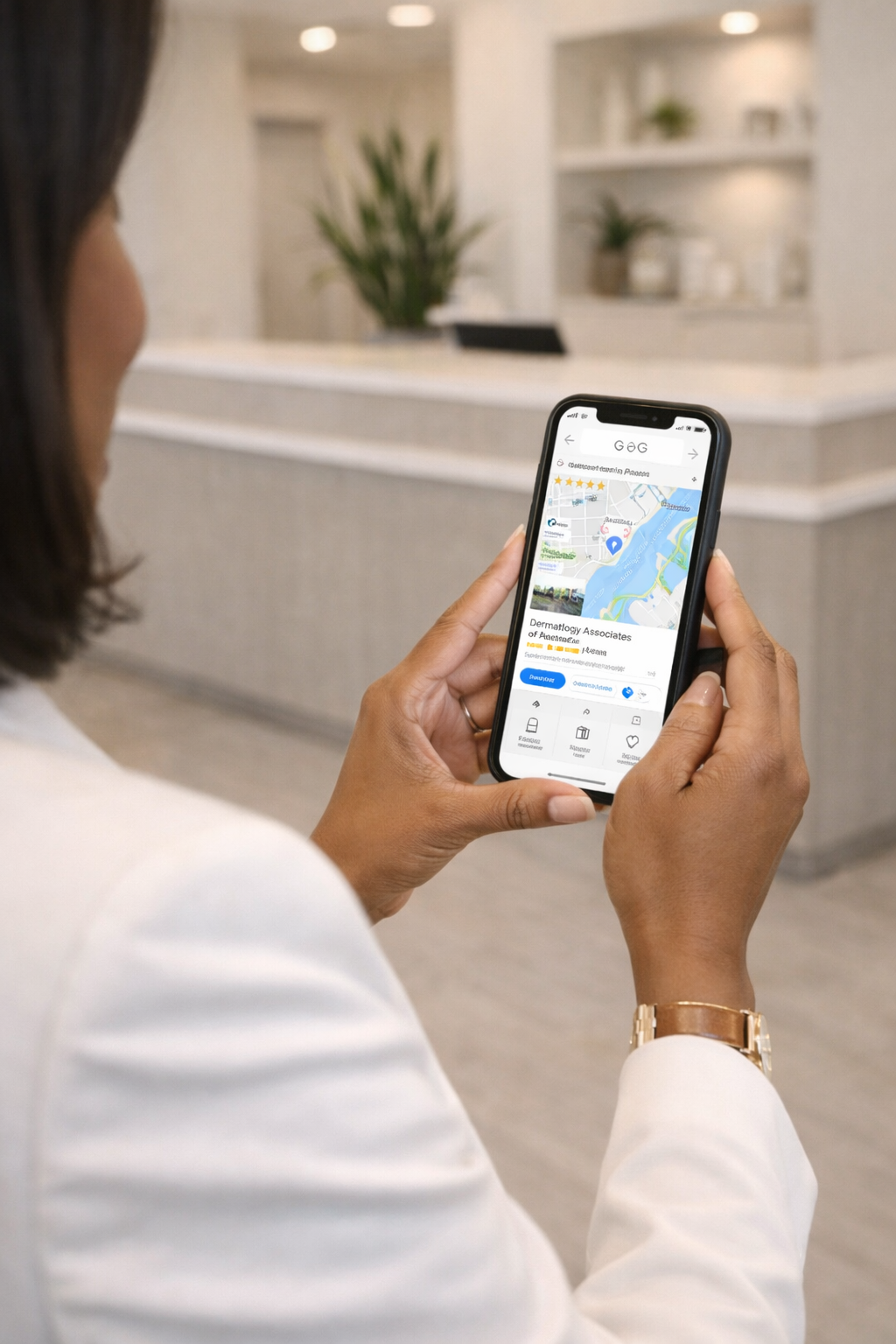 Detroit med spa owner reviewing Google Maps search results on her smartphone in a modern med spa reception area