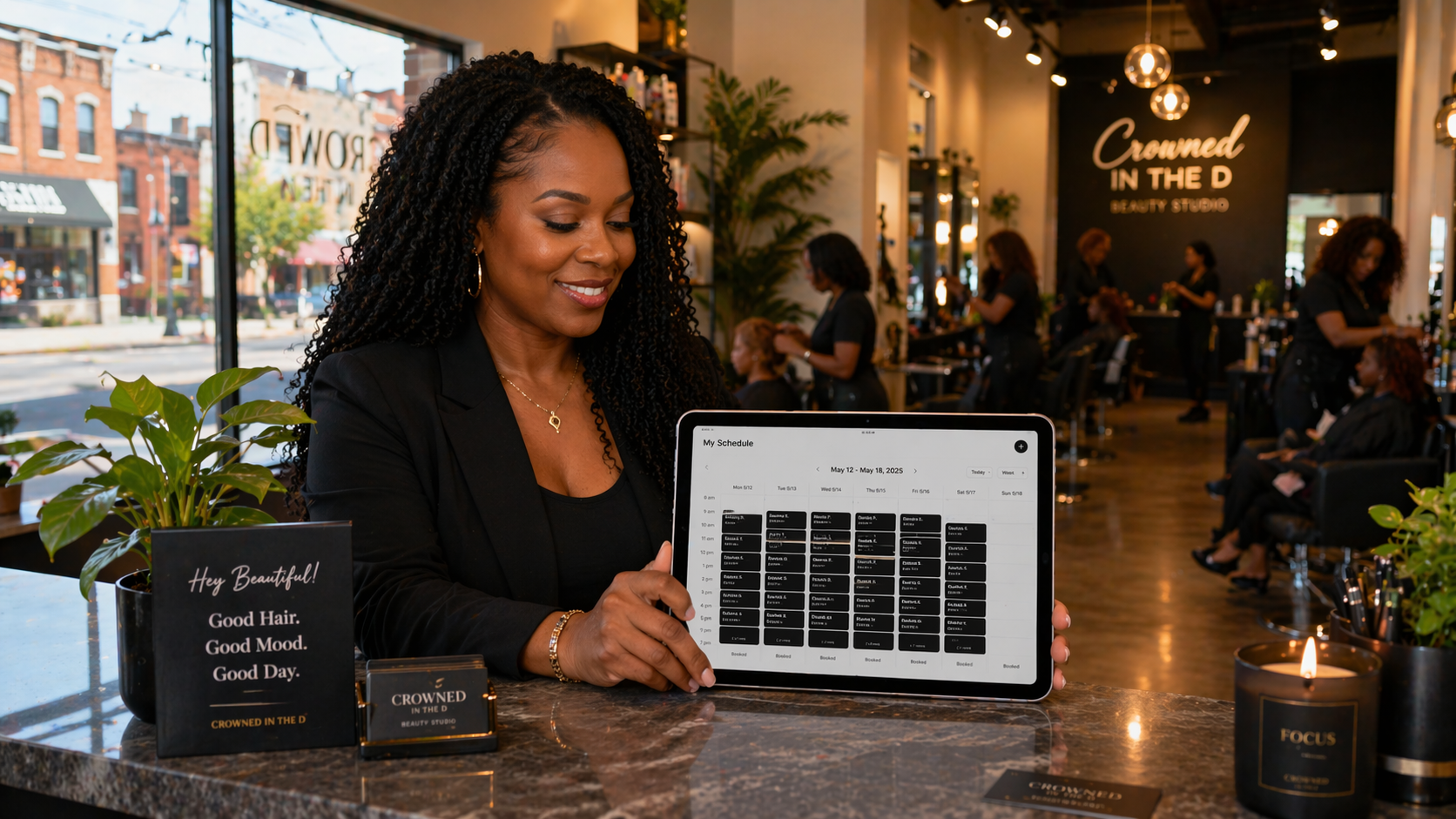 Woman on her phone booking a salon appointment through an online booking app, sitting at home in warm natural light