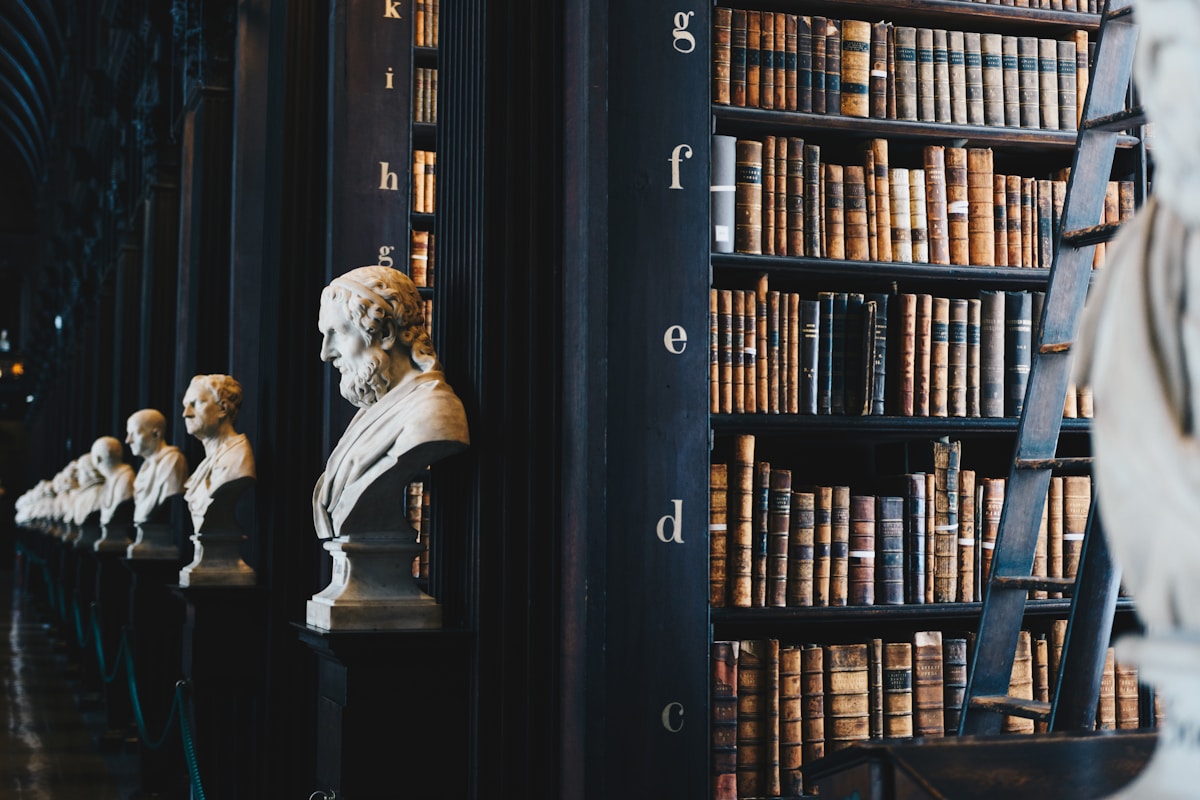 Law library with marble busts and legal volumes — the depth of authority a Detroit law firm website must convey